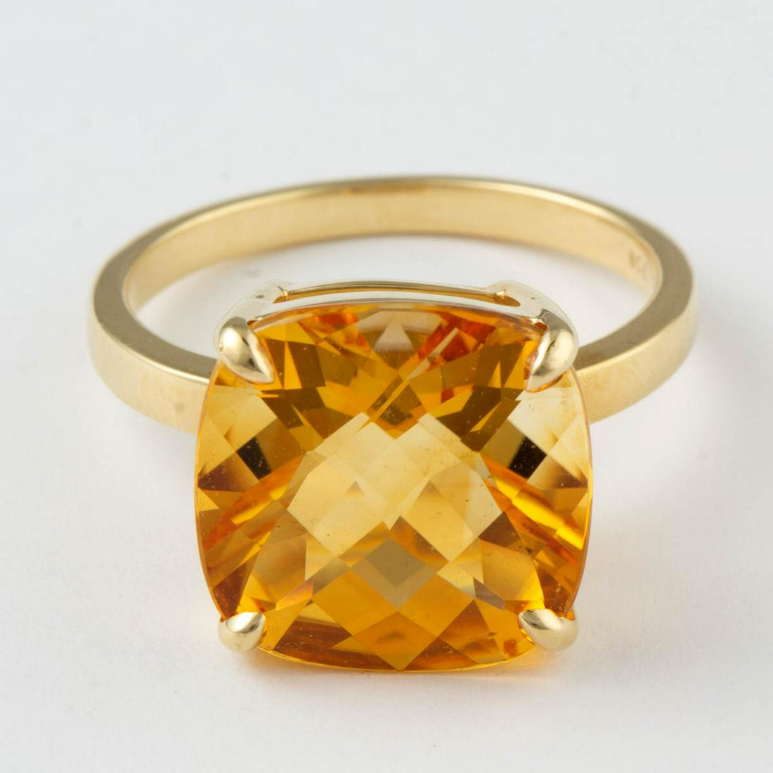 TIFFANY & CO. 18K YELLOW GOLD AND CITRINE SOLITAIRE: TIFFANY & CO. 18K YELLOW GOLD AND CITRINE SOLITAIRE RING, having a 14 x 14 mm checkerboard-cut citrine in four-prong setting on a plain band. Interior band marked "(c) TIFFANY & CO. 750". Total weight