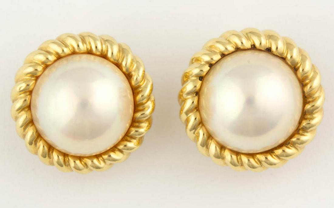 VINTAGE TIFFANY & CO. 18K YELLOW GOLD AND PEARL: VINTAGE TIFFANY & CO. 18K YELLOW GOLD AND PEARL EARRINGS, PAIR, each round form with a 13.5 mm pearl center in a rope-pattern setting, post back with omega clip fastener, including a Tiffany & Co. clo