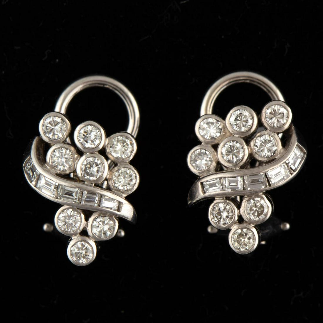 VINTAGE 14K WHITE GOLD AND DIAMOND EARRINGS, PAIR: VINTAGE 14K WHITE GOLD AND DIAMOND EARRINGS, PAIR, each cluster form with post back and omega clip fastener having nine 2 mm round brilliant-cut diamonds in bezel settings and five baguette-cut diamon