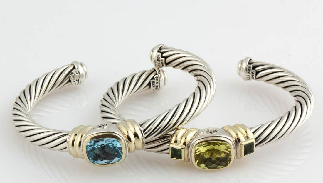 DAVID YURMAN STERLING SILVER, 14K GOLD-ACCENTED, AND: DAVID YURMAN STERLING SILVER, 14K GOLD-ACCENTED, AND GEMSTONE CUFF BRACELETS, LOT OF TWO, each having cable pattern, comprising one with a blue topaz stone and one with a lemon citrine stone flanked b