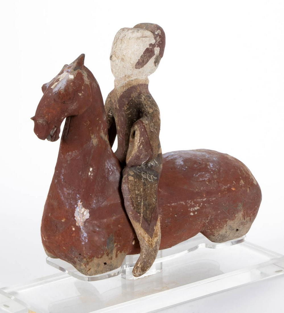 CHINESE EARTHENWARE HORSE AND RIDER TOMB FIGURE: CHINESE EARTHENWARE HORSE AND RIDER TOMB FIGURE, each with remnants of pigment, including an acrylic stand. An undated descriptive sheet from Arch Angel Antiques, Hong Kong, and an analysis sheet from
