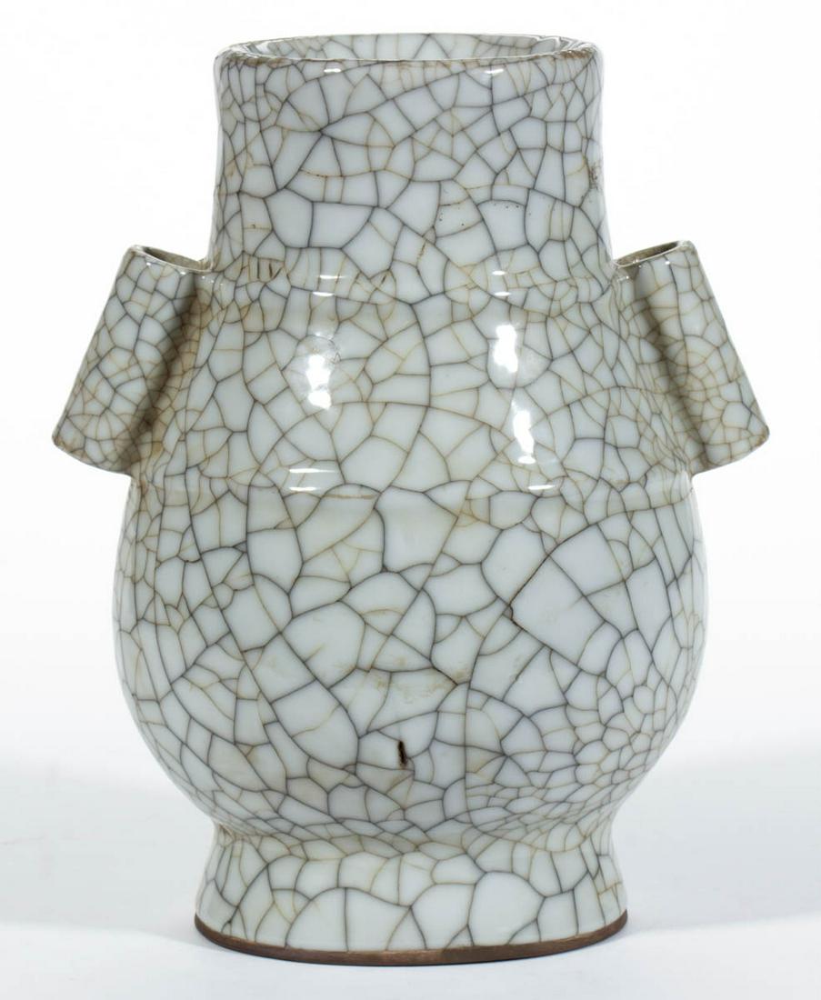 CHINESE QING-STYLE GE WARE CERAMIC VASE: CHINESE QING-STYLE GE WARE CERAMIC VASE, Hu form with two vertical tubular handles, having bold crackle glaze and an iron oxide foot ring. Unmarked. 19th century, or later. 10 5/8" HOA. Undamaged, exc