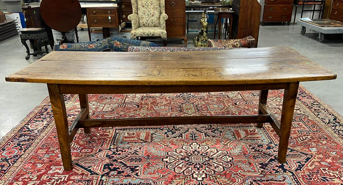FRENCH PROVINCIAL FRUITWOOD FARM TABLE: FRENCH PROVINCIAL FRUITWOOD FARM TABLE, three-board rectangular top with bread board ends, raised on square-tapered legs, connected by a stretcher-base. Retains an old refinished surface with warm col