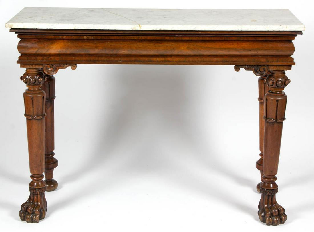 AMERICAN CLASSICAL CARVED ROSEWOOD MARBLE-TOP SERVING: AMERICAN CLASSICAL CARVED ROSEWOOD MARBLE-TOP SERVING TABLE, featuring rectangular top, full drawer with molded-edge facing, and stylized paw feet. Poplar secondary wood. Old surface with warm color.