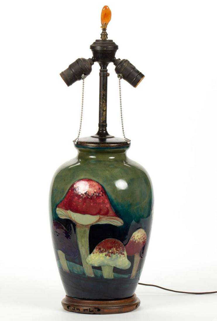 ENGLISH MOORCROFT ART POTTERY VASE TABLE LAMP: ENGLISH MOORCROFT ART POTTERY VASE TABLE LAMP, featuring charming polychrome hand-painted toadstools on greenish-blue ground, having drilled hole to bottom with period double socket form. Having impre
