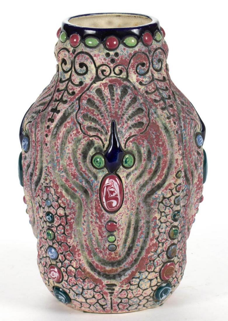 CZECHOSLOVAKIAN AMPHORA ART POTTERY VASE: CZECHOSLOVAKIAN AMPHORA ART POTTERY VASE, having several polychrome jeweled cabochons with stylized incised shell and cobble stone designs and sponged burgundy and blue decoration. Having oval stamped