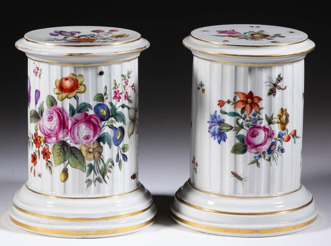 GERMAN FURSTENBERG PORCELAIN PAIR OF COLUMN PEDESTALS: GERMAN FURSTENBERG PORCELAIN PAIR OF COLUMN PEDESTALS, each having bright polychrome hand-painted floral decoration with insects and gilt banding. Each having underglaze blue "F" mark. Second half 19t