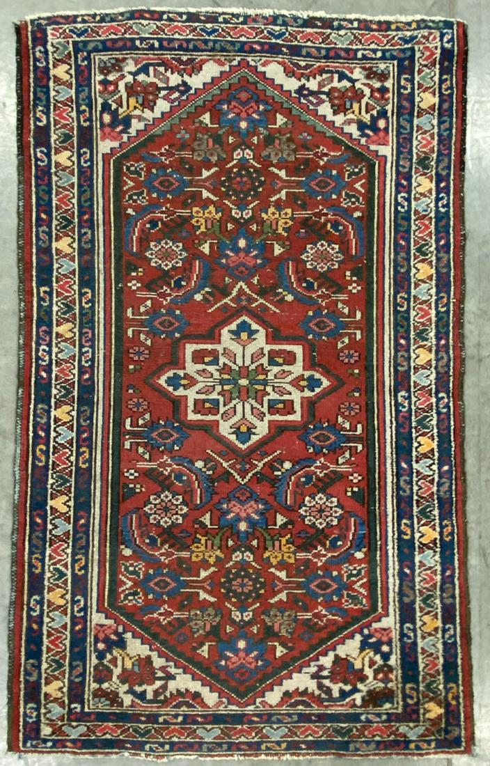 SEMI-ANTIQUE PERSIAN SCATTER RUG: SEMI-ANTIQUE PERSIAN SCATTER RUG, bold colors, red and blue ground, with floral patterns. Second half 20th century. 4' x 2' 5".Very good overall condition, minor losses to edges and trim, and with are