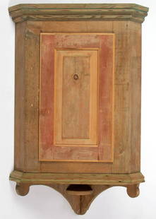 REPRODUCTION MIXED WOOD HANGING CORNER CABINET, NOT: REPRODUCTION MIXED WOOD HANGING CORNER CABINET, NOT FINISHED, bench-made from old wood, single raised-panel door, single interior shelf, lower drop with small shelf. With two reproduction rat-tail hin