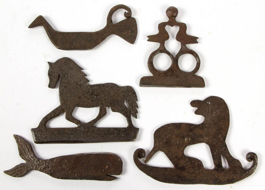 ASSORTED WROUGHT-IRON FIGURAL FLINT STRIKERS, LOT OF: ASSORTED WROUGHT-IRON FIGURAL FLINT STRIKERS, LOT OF FIVE, comprising a bird, dog, horse, whale, and two doves over rings. 19th century. 3 3/8" to 3 3/4" HOA.Very good overall condition with expected