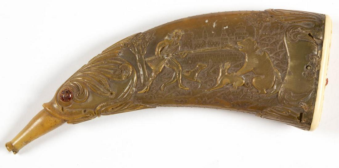 SCOTTISH OR GERMAN RELIEF CARVED POWER HORN: SCOTTISH OR GERMAN RELIEF CARVED POWER HORN, terminating in a fish head, with hunting scenes. 19th century or earlier. 8" L. Good as-found condition, scattered minor to moderate areas of bug damage, s