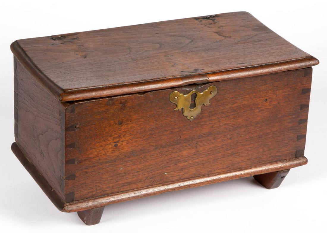 VIRGINIA WALNUT DIMINUTIVE BOX: VIRGINIA WALNUT DIMINUTIVE BOX, hinged molded-edge lid over a dovetailed case raised on applied shoe feet. Old surface with warm color. Possibly Shenandoah Valley of Virginia. Fourth quarter 18th cent