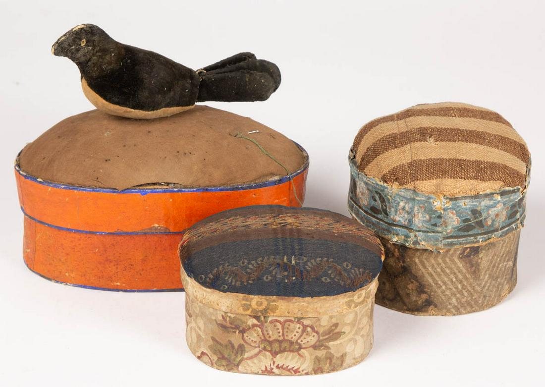 AMERICAN WALLPAPER-COVERED SEWING BOXES, LOT OF THREE: AMERICAN WALLPAPER-COVERED SEWING BOXES, LOT OF THREE, each with pin cushion top. Together with a figural bird pin cushion of the period. Four pieces total. 19th century. Largest 4" HOA, 7" LOA. Good 