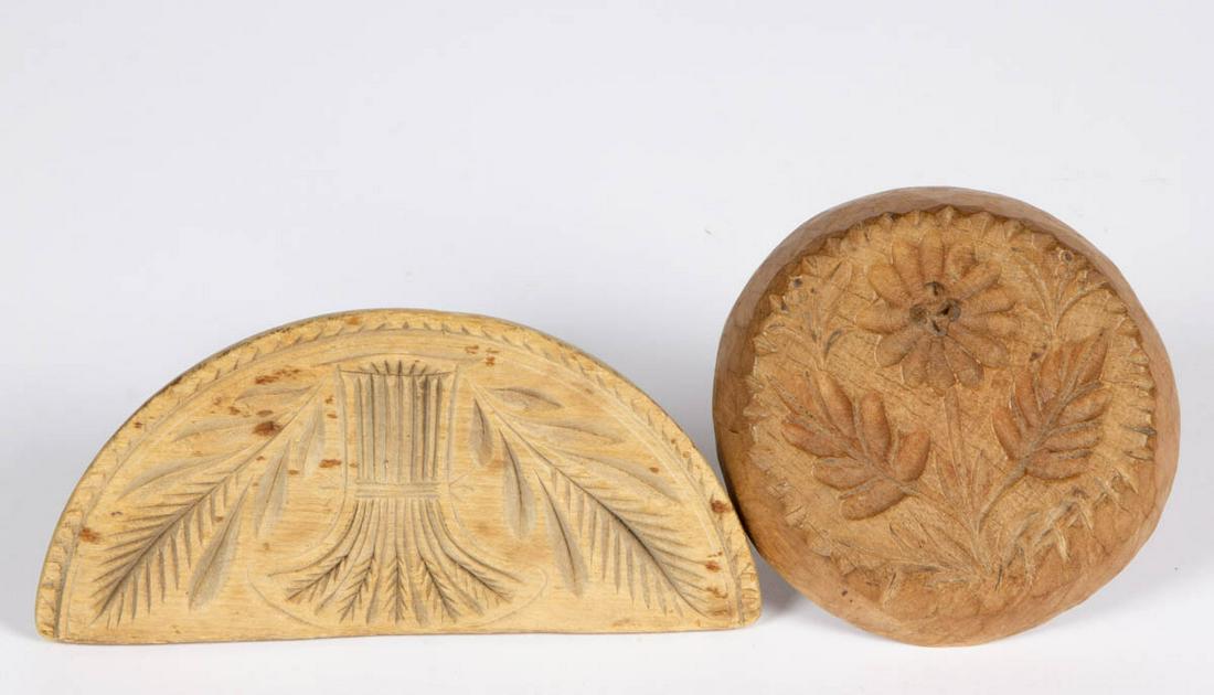 AMERICAN CARVED TREEN BUTTER PRINTS, LOT OF TWO: AMERICAN CARVED TREEN BUTTER PRINTS, LOT OF TWO, comprising a half-round example with central sheaf-of-wheat design, and a thick circular example with daisy and leaves design, and whittled edges, each