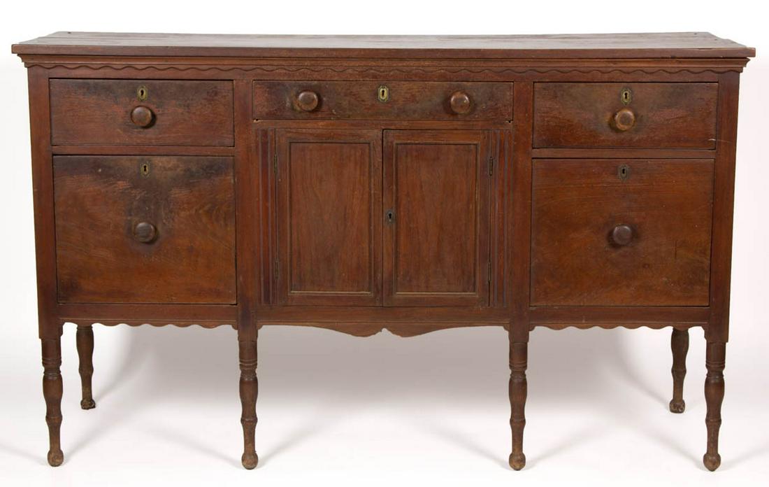 VIRGINIA LATE FEDERAL WALNUT SIDEBOARD: VIRGINIA LATE FEDERAL WALNUT SIDEBOARD, rectangular two-board top over three short scratch-beaded drawers above two hinged fielded-panel cupboard doors flanked by channel-molded stiles and pair of bot