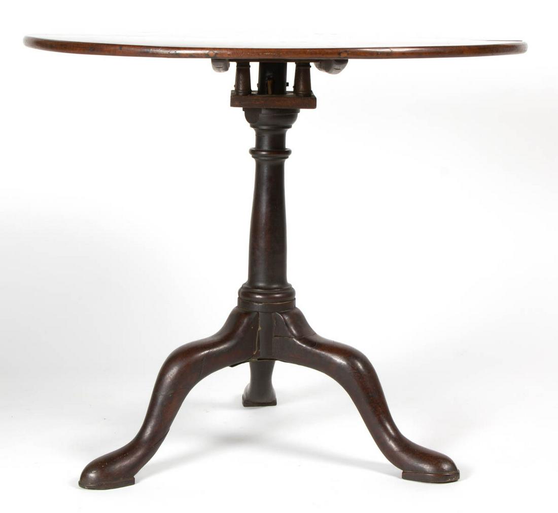 AMERICAN OR BRITISH QUEEN ANNE MAHOGANY TILT-TOP TEA: AMERICAN OR BRITISH QUEEN ANNE MAHOGANY TILT-TOP TEA TABLE, circular top with molded edge, above a baluster-turned standard raised on a tripod base of sweeping cabriole legs ending in slipper feet. Ol