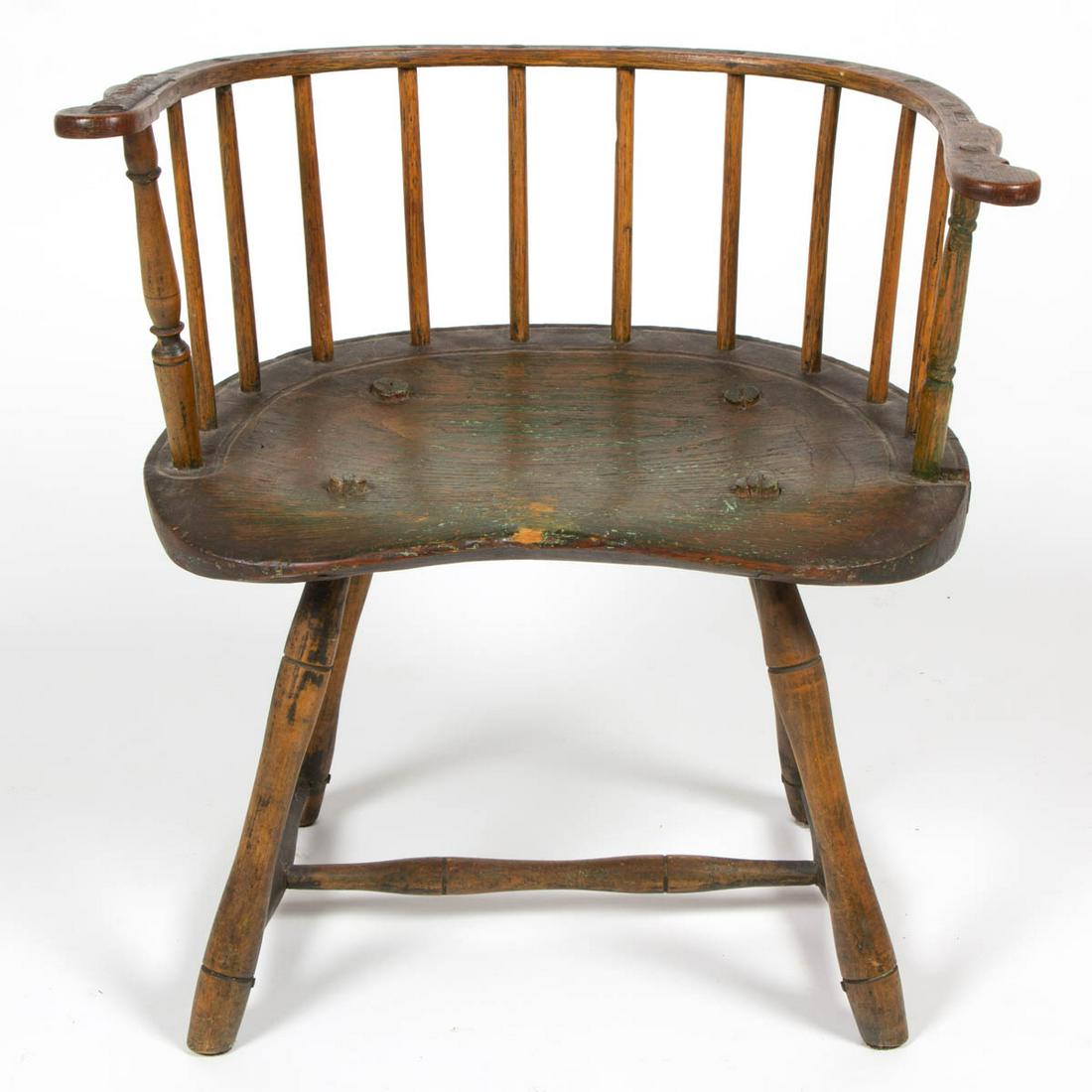 AMERICAN PAINTED WINDSOR LOW-BACK CHAIR: AMERICAN PAINTED WINDSOR LOW-BACK CHAIR, retains traces of an old green-painted surface. Circa 1780. 22 1/2" HOA, 14 1/4" H seat, 12 1/2" D seat. Very good overall condition, with old wrought-iron rep