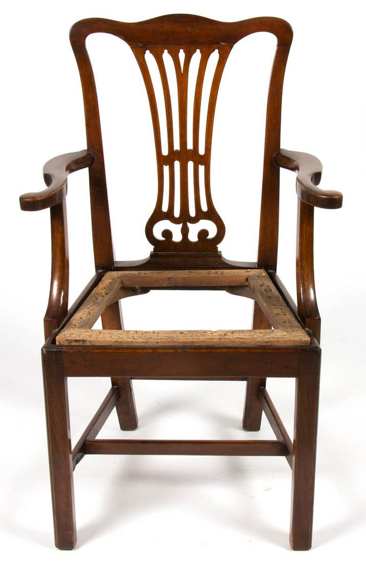 AMERICAN OR BRITISH CHIPPENDALE MAHOGANY ARM CHAIR: AMERICAN OR BRITISH CHIPPENDALE MAHOGANY ARM CHAIR, shaped crest rail, pierced splat, molded trapezoidal seat frame, square legs joined with box stretcher. Old refinished surface with warm color. Late