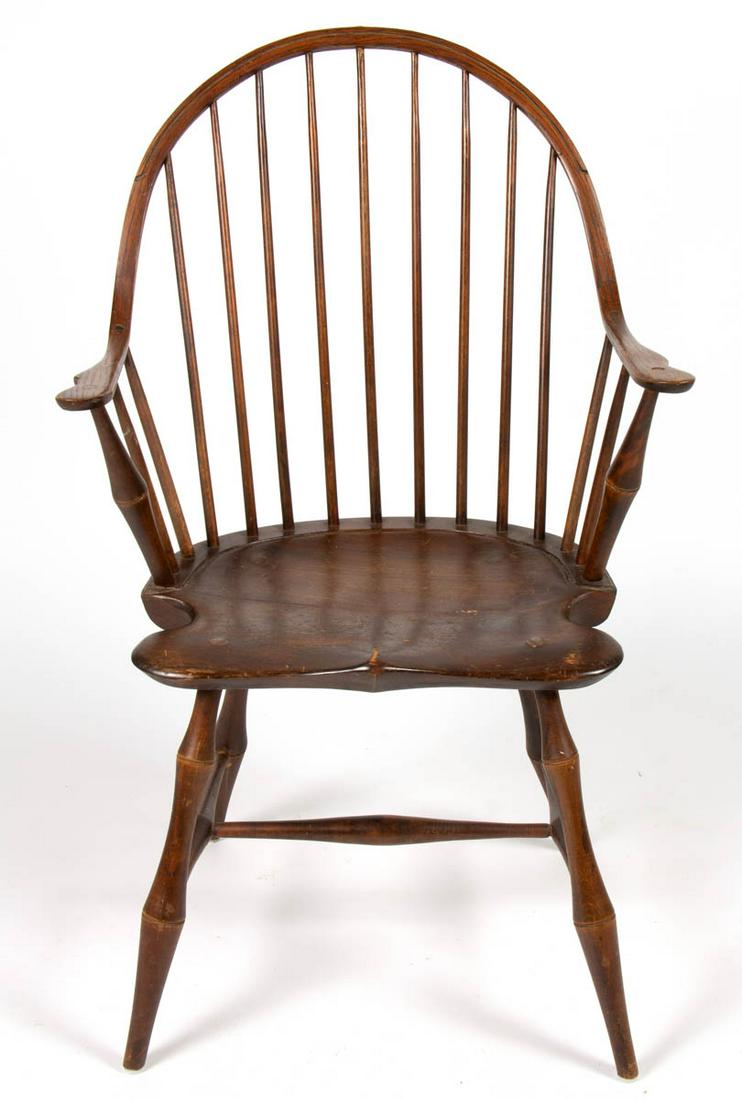 AMERICAN COUNTRY BOWBACK WINDSOR CHAIR: AMERICAN COUNTRY BOWBACK WINDSOR CHAIR, with seven-spindle back, shaped seat, and bamboo-style legs joined with box stretcher.no markings located. Old surface with warm color. 19th century. 38 1/2" HO