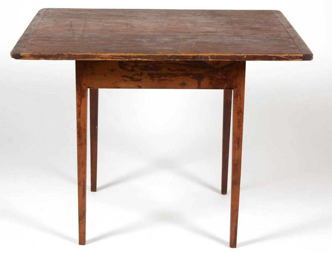 AMERICAN COUNTRY PAINTED PINE STAND TABLE: AMERICAN COUNTRY PAINTED PINE STAND TABLE, rectangular top with breadboard ends, raised on square-tapered legs. Retains an old red-wash. Circa 1840. 26" H, 29 3/4" x 34" top. Good overall condition, a