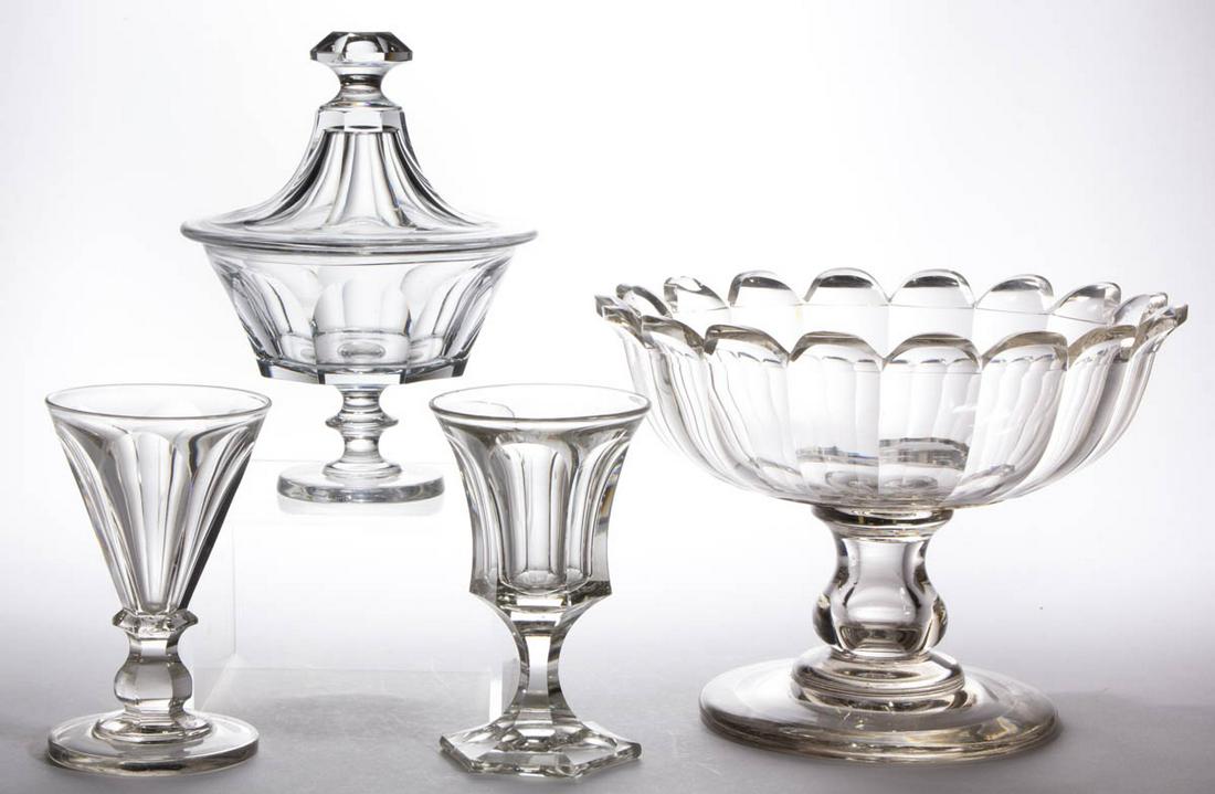 ASSORTED EARLY CUT GLASS ARTICLES, LOT OF FOUR: ASSORTED EARLY CUT GLASS ARTICLES, LOT OF FOUR, colorless, comprising two goblets, a covered sugar bowl, and a large open compote, each having cut-fluted patterns. Various makers. Third quarter 19th c