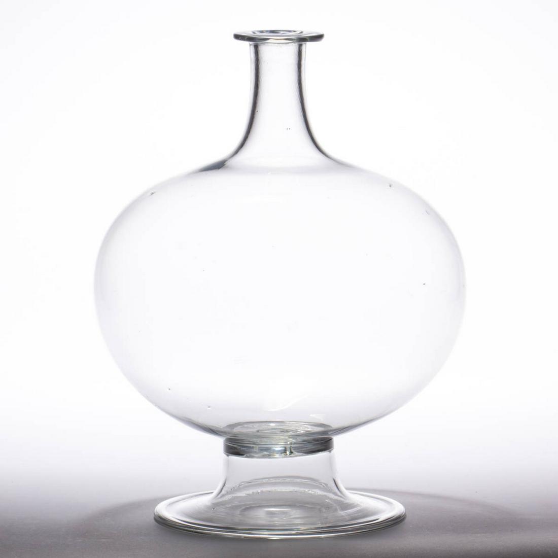 FREE-BLOWN GLASS WATER LENS FOR LIGHTING: FREE-BLOWN GLASS WATER LENS FOR LIGHTING, colorless, large globular form, applied flaring foot with a rolled-over edge. Maker unverified. First half 19th century. 11 1/4" H, 7 3/4" DOA. Undamaged with