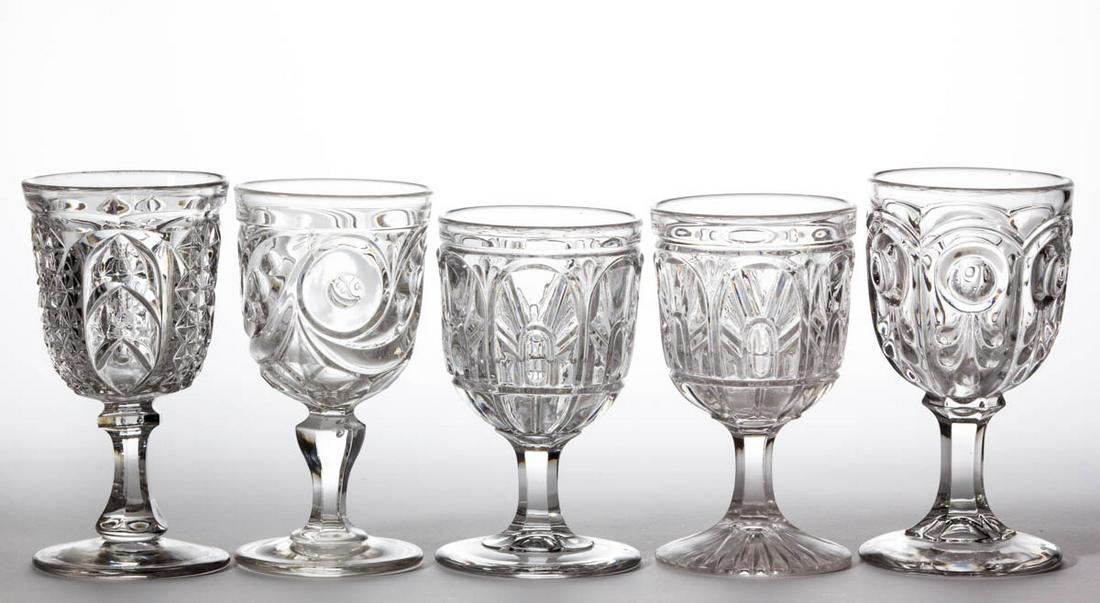 ASSORTED FLINT EAPG GOBLETS, LOT OF FIVE: ASSORTED FLINT EAPG GOBLETS, LOT OF FIVE, colorless lead glass, comprising two Gothic, a Scarab, a Bull's Eye with Fleur-de-lys, and a Comet. Boston & Sandwich Glass Co. and others. Third quarter 19th