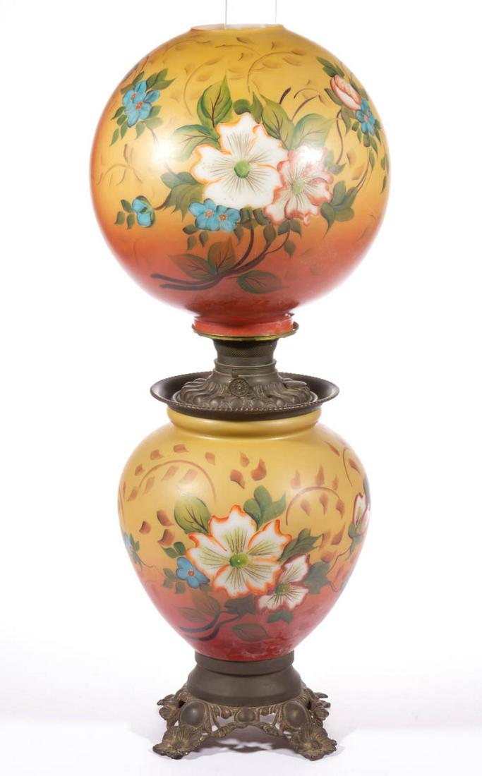 VICTORIAN ENAMEL-DECORATED GONE WITH THE WIND / PARLOR: VICTORIAN ENAMEL-DECORATED GONE WITH THE WIND / PARLOR LAMP, opaque white with polychrome-enamel decoration, matching ball-form shade with floral decoration, large urn-form base with metal floral foot