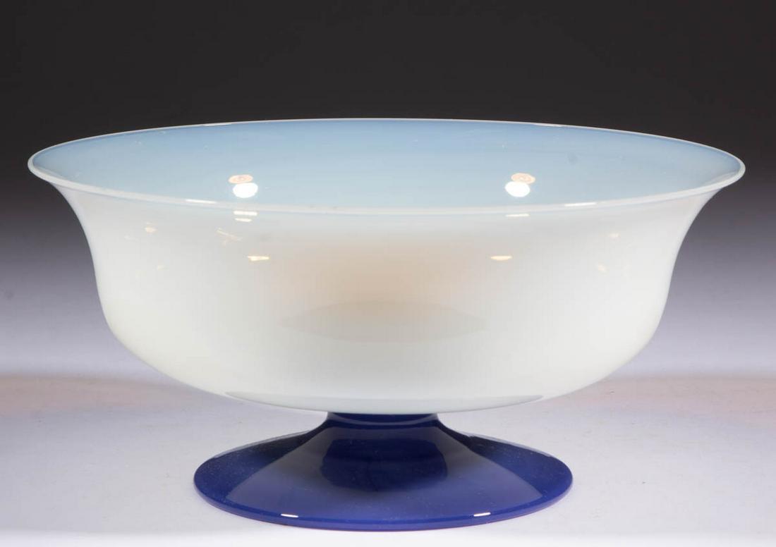 FRY FOVAL ART GLASS FOOTED BOWL: FRY FOVAL ART GLASS FOOTED BOWL, opalescent, applied Delft foot, polished pontil mark. H. C. Fry Glass Co. First half 20th century. 3 7/8" H, 8" D rim, 4 1/4" D foot.Undamaged with some minor interior