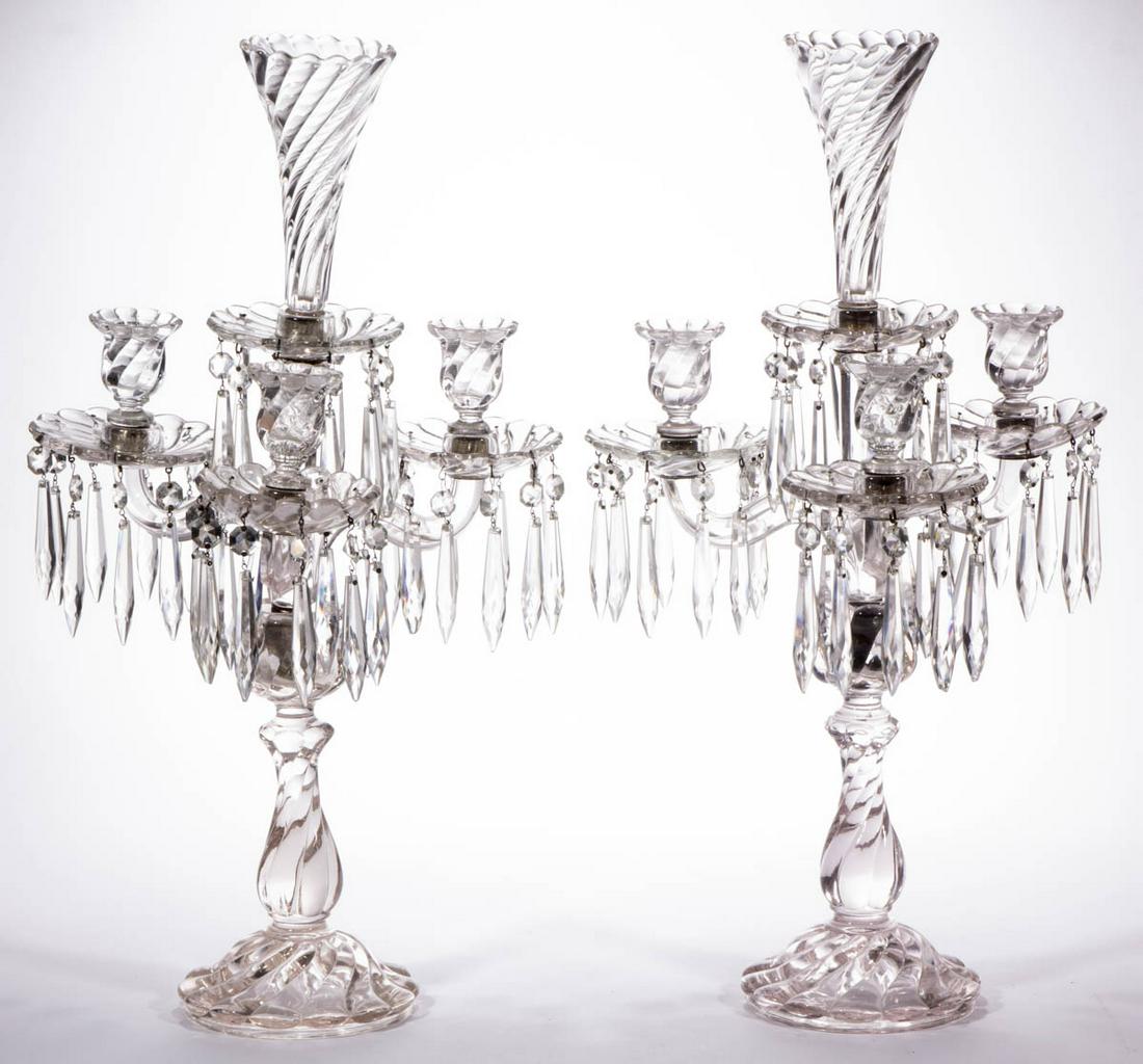FOSTORIA COLONY PAIR OF CANDELABRAS: FOSTORIA COLONY PAIR OF CANDELABRAS, colorless, each having a baluster-form base, central four-arm standard, three swirled sockets with matching bobeches and hanging cut prisms, central swirled vase. 