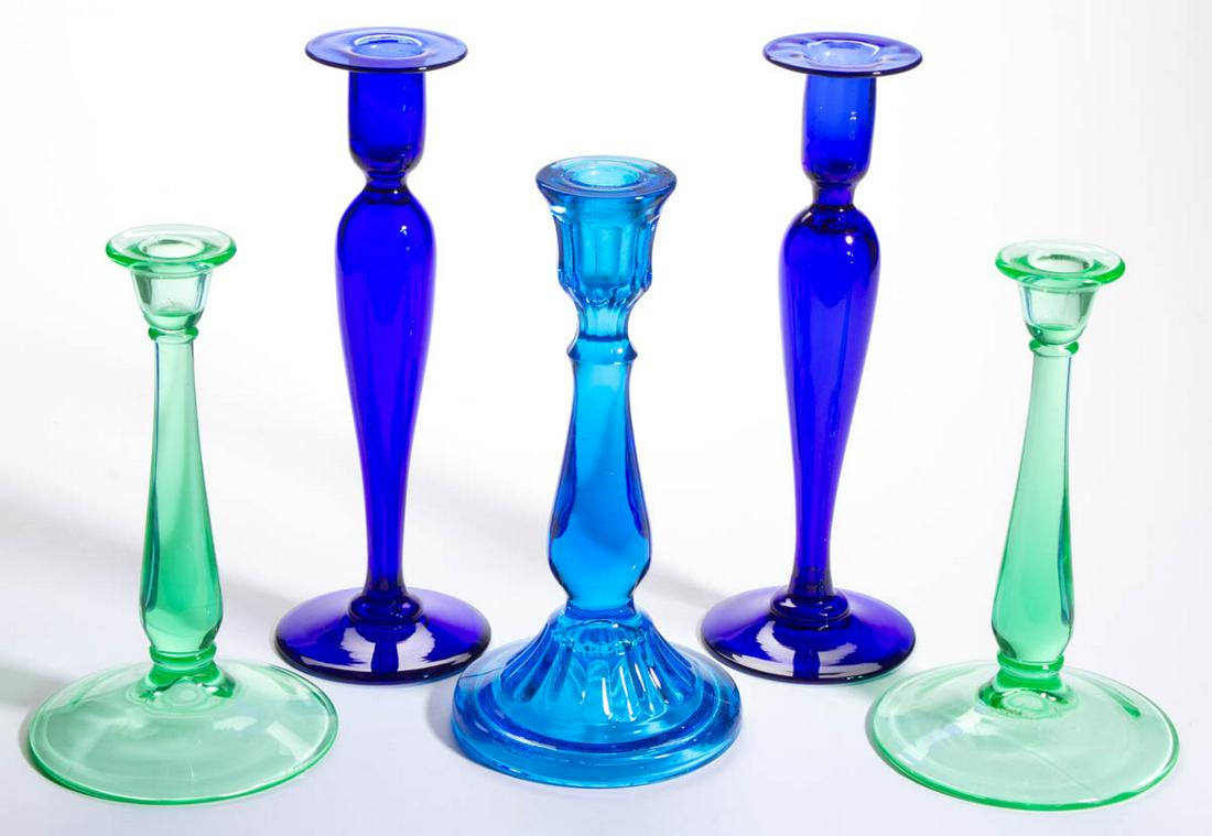 ASSORTED GLASS CANDLESTICKS, LOT OF FIVE: ASSORTED GLASS CANDLESTICKS, LOT OF FIVE, blue and green (reacts under black light), including a pair of tall Pairpoint examples. Various makers. Fourth quarter 19th/first quarter 20th century. 9 1/2"