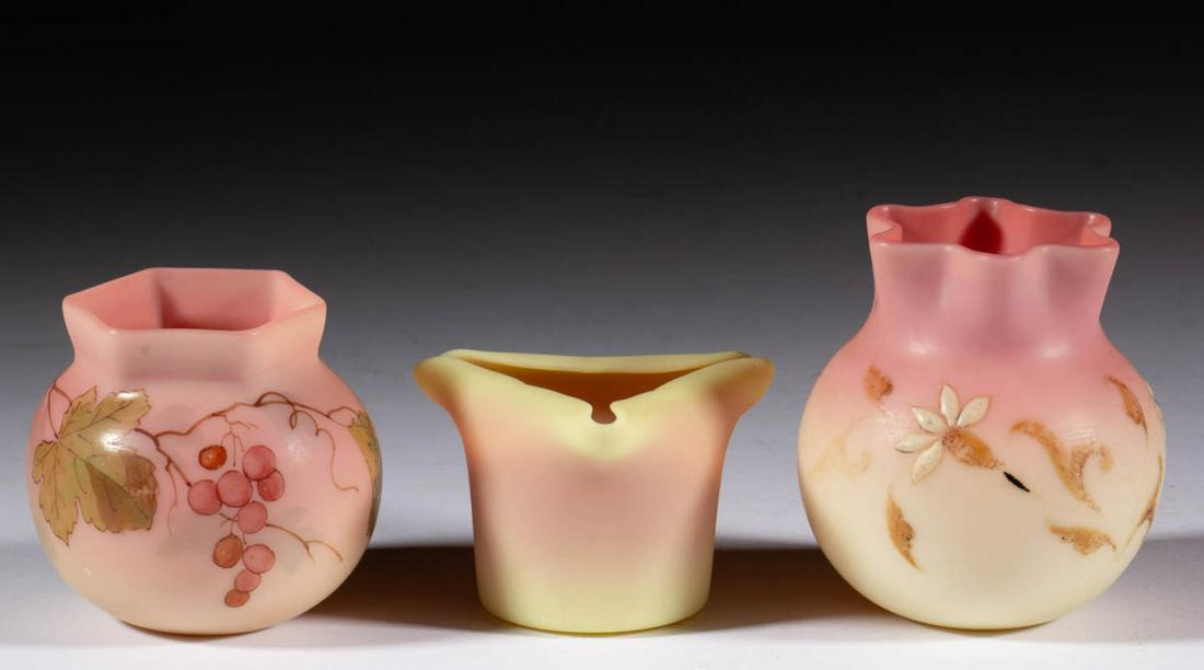 ASSORTED BURMESE GLASS TOOTHPICK HOLDERS, LOT OF THREE: ASSORTED BURMESE GLASS TOOTHPICK HOLDERS, LOT OF THREE, plush, comprising two Webb enamel-decoration, and a Mt. Washington Tri-corner example. Mt. Washington Glass Co. and Thomas Webb & Sons. Fourth q