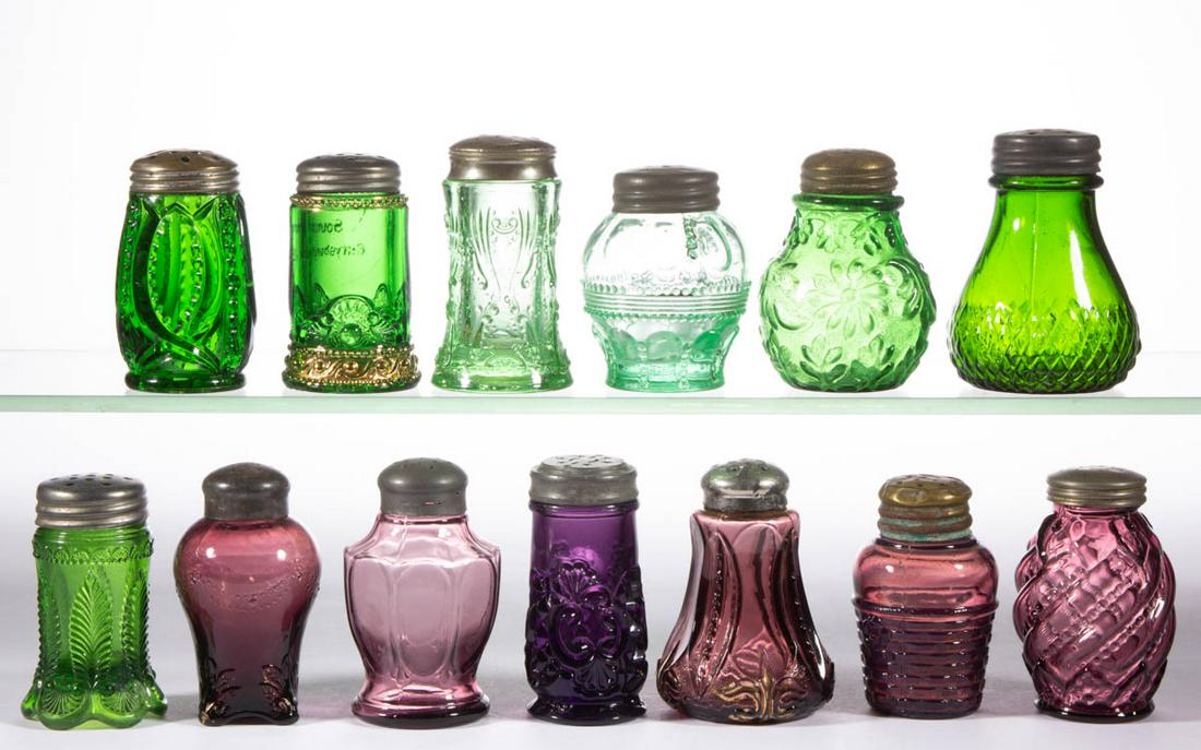 ASSORTED EAPG SALT / PEPPER SHAKERS, LOT OF 13: ASSORTED EAPG SALT / PEPPER SHAKERS, LOT OF 13, amethyst and green, including a Riverside Croseus, a Nestor, a Swag with Brackets, and an Iris and Meander, each having a period lid. Late 19th/early 20