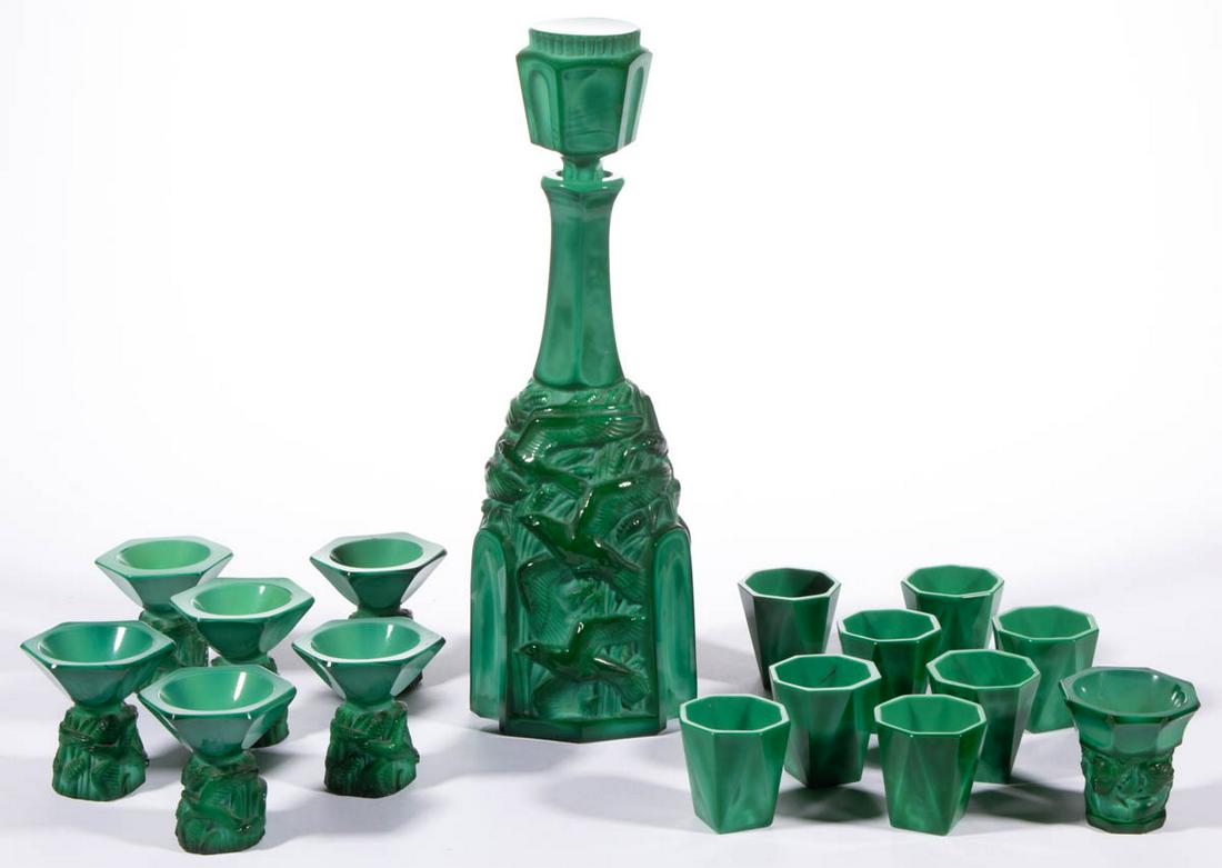 CZECH MALACHITE GLASS DRINKING ARTICLES, LOT OF 16: CZECH MALACHITE GLASS DRINKING ARTICLES, LOT OF 16, green agate, comprising a seagulls seven-piece wine set, a cherubs wine, and eight faceted diminutive tumblers. Czech Republic. 20th century. 1 7/8"