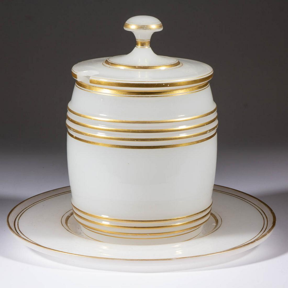 CONTINENTAL OPALINE GLASS PUNCH BOWL AND UNDERTRAY: CONTINENTAL OPALINE GLASS PUNCH BOWL AND UNDERTRAY, alabaster/clambroth with gilt decoration, comprising a barrel-form punch bowl with original cover and matching undertray. European. Fourth quarter 1