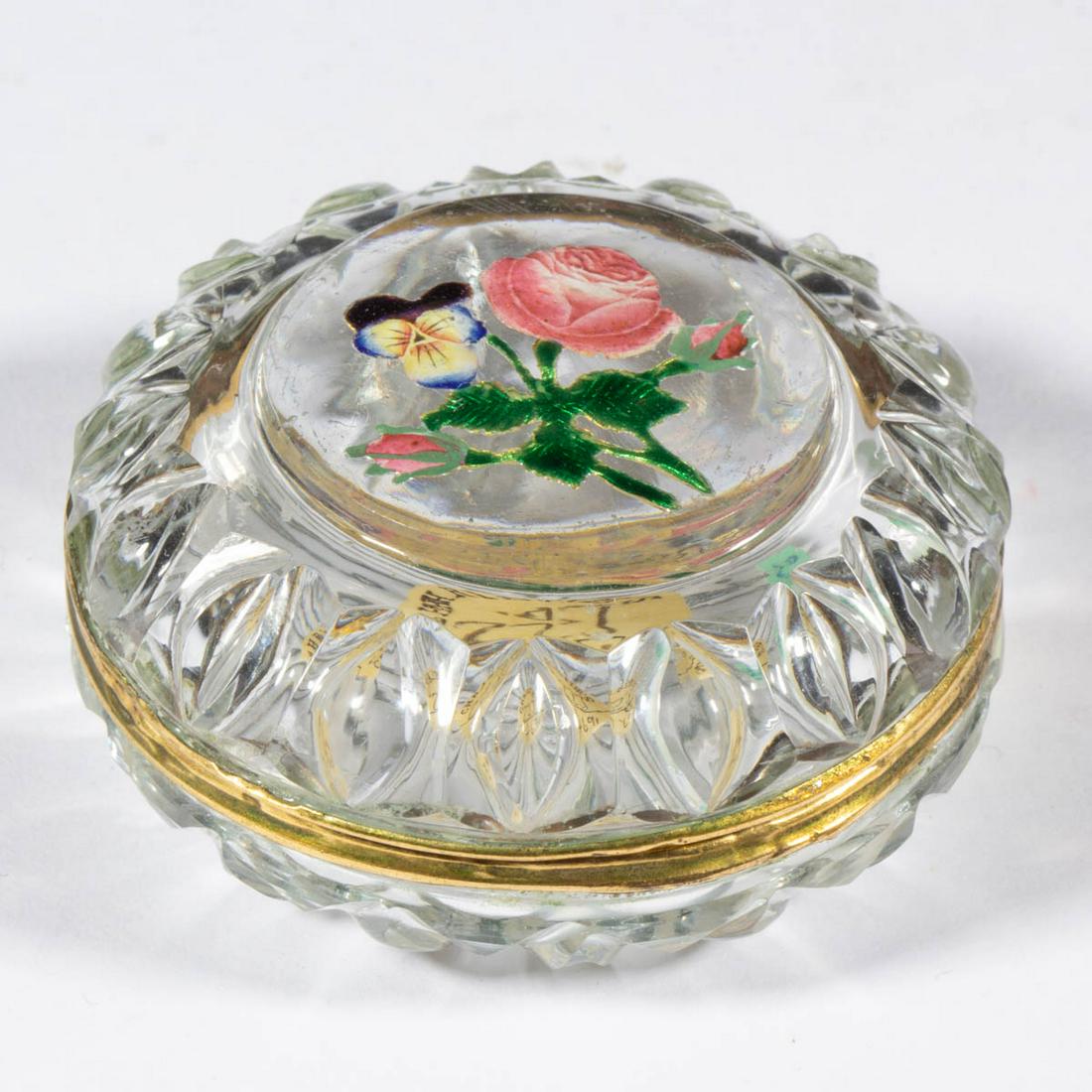 BACCARAT ENAMEL-DECORATED AND GOLD FOIL PATCH BOX: BACCARAT ENAMEL-DECORATED AND GOLD FOIL PATCH BOX, colorless with polychrome-enamel decoration, pressed oval shoulder and pressed loop base, rose and pansy gold foil bouquet with enamel decoration on 