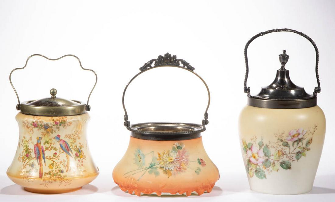 ASSORTED DECORATED OPAL CRACKER / BISCUIT JARS, LOT OF: ASSORTED DECORATED OPAL CRACKER / BISCUIT JARS, LOT OF TWO, opaque white with various grounds, comprising a molded Pairpoint with polychrome-enamel floral decoration and lacking cover, and a Wave Cres