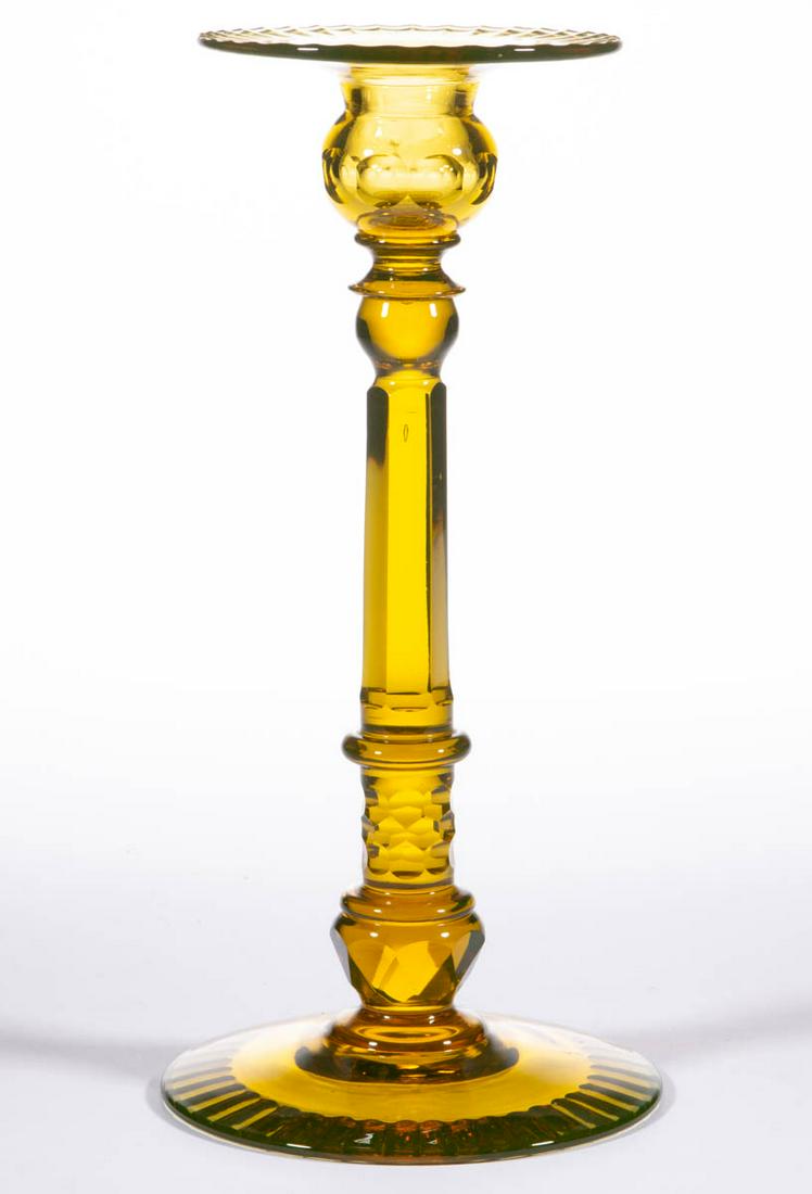 UNIDENTIFIED / POSSIBLY STEUBEN CUT GLASS CANDLESTICK: UNIDENTIFIED / POSSIBLY STEUBEN CUT GLASS CANDLESTICK, unusual amber with a green tint (reacts under black light), wide galleried socket with a cut edge, socket with a chain of punties, complex stem f