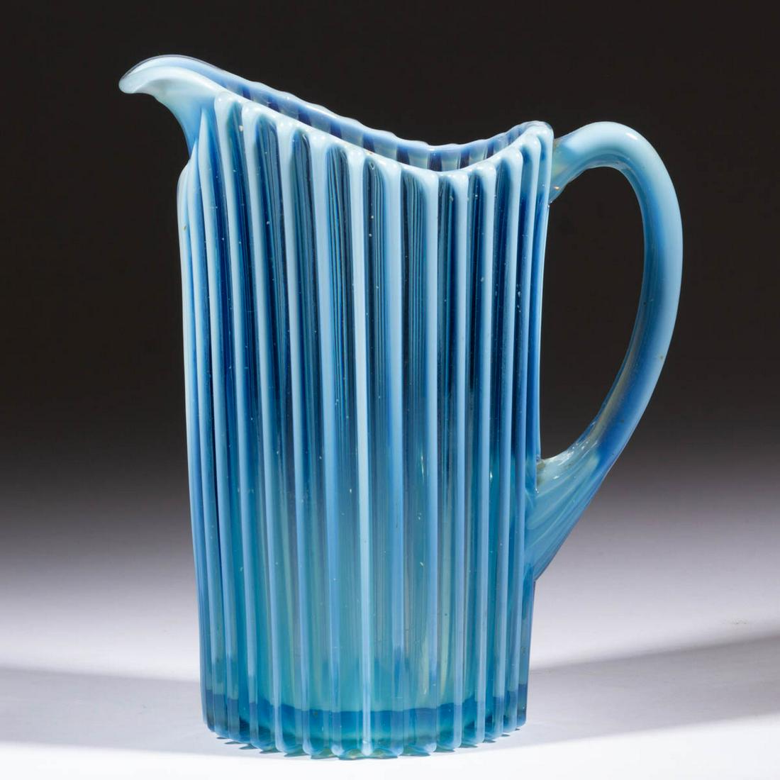 BEATTY RIB WATER PITCHER: BEATTY RIB WATER PITCHER, blue opalescent. A. J. Beatty & Sons. Circa 1889. 9 1/8" HOA. Undamaged. Literature: Parallels Heacock/Elmore - Opalescent Glass From A-Z, pp. 120 and 125, figs. 129 and 213.