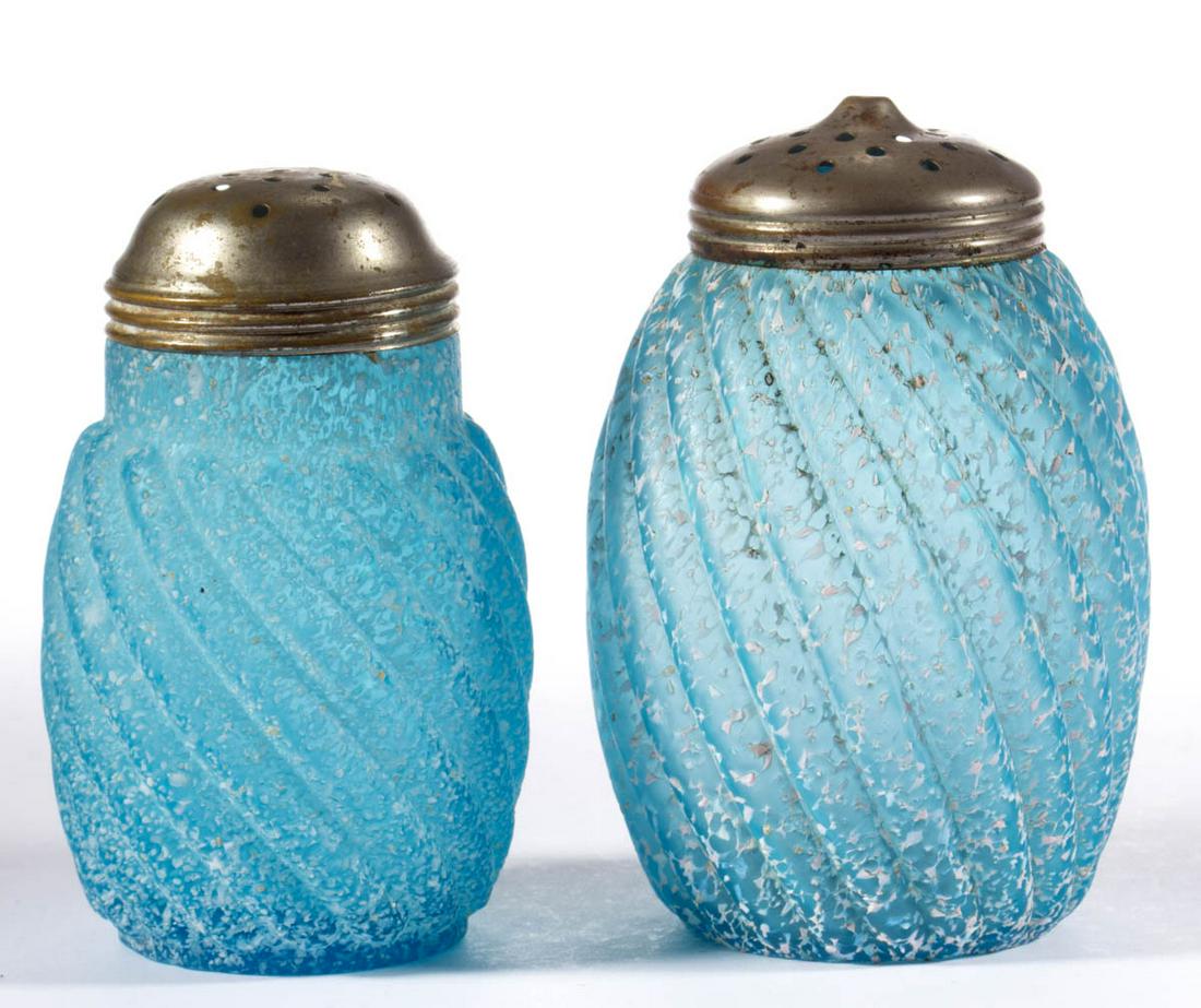 GRANITEWARE - REVERSE SWIRL SUGAR SHAKERS, LOT OF TWO: GRANITEWARE - REVERSE SWIRL SUGAR SHAKERS, LOT OF TWO, blue with opal frit decoration, each having a period lid. Northwood Glass Co./Buckeye Glass Co. Circa 1890. 4 3/4" and 5" H. Larger undamaged; sm