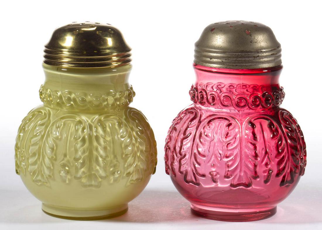 NORTHWOOD NO. 263 / LEAF UMBRELLA SUGAR SHAKERS, LOT OF: NORTHWOOD NO. 263 / LEAF UMBRELLA SUGAR SHAKERS, LOT OF TWO, Topaz/cased lemon glossy (reacts under black light) and cranberry, each having a period lid. Northwood Glass Co. Pattern introduced 1889. 4
