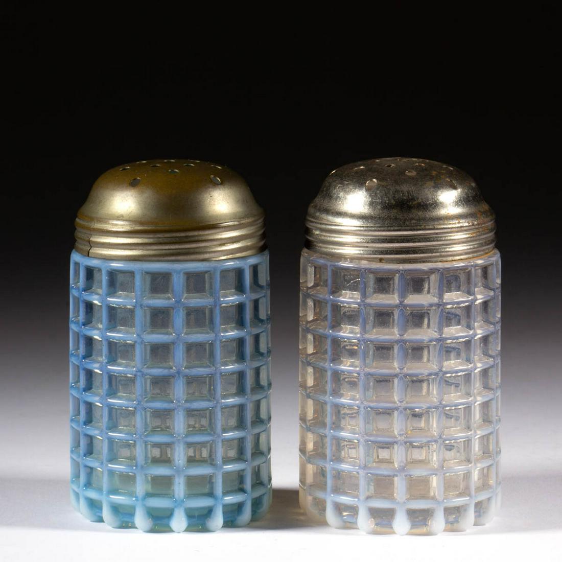 BEATTY WAFFLE SUGAR SHAKERS, LOT OF TWO: BEATTY WAFFLE SUGAR SHAKERS, LOT OF TWO, colorless opalescent and blue opalescent, each having a period lid. A. J. Beatty & Sons. Circa 1889. 3 7/8" H. Undamaged with the blue example having some surf