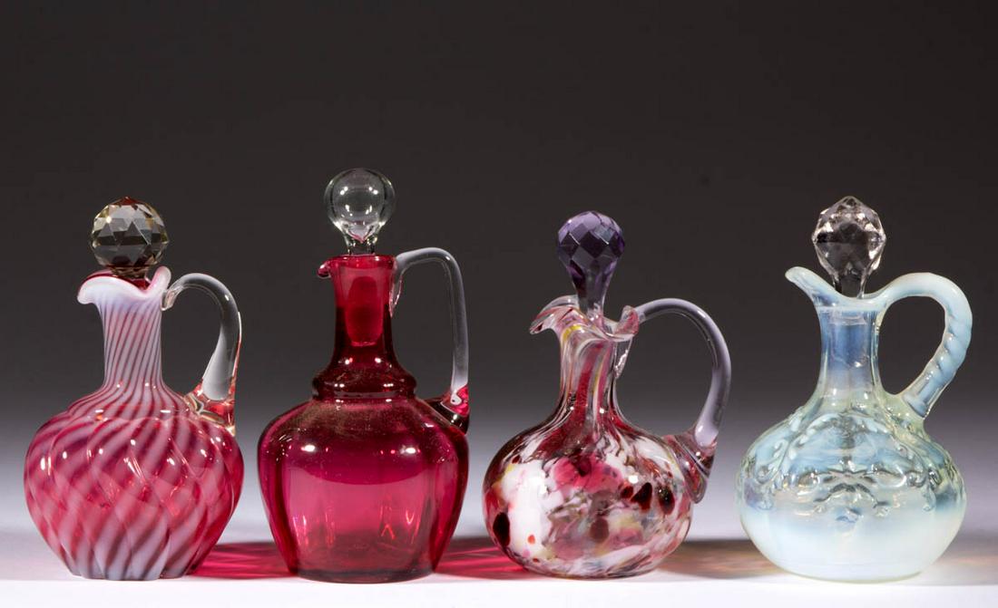 ASSORTED VICTORIAN GLASS CRUETS, LOT OF FOUR: ASSORTED VICTORIAN GLASS CRUETS, LOT OF FOUR, comprising a colorless opalescent Intaglio, a cranberry opalescent Swirl, a polychrome spatter example, and a cranberry Panel-Optic, each with an applied 