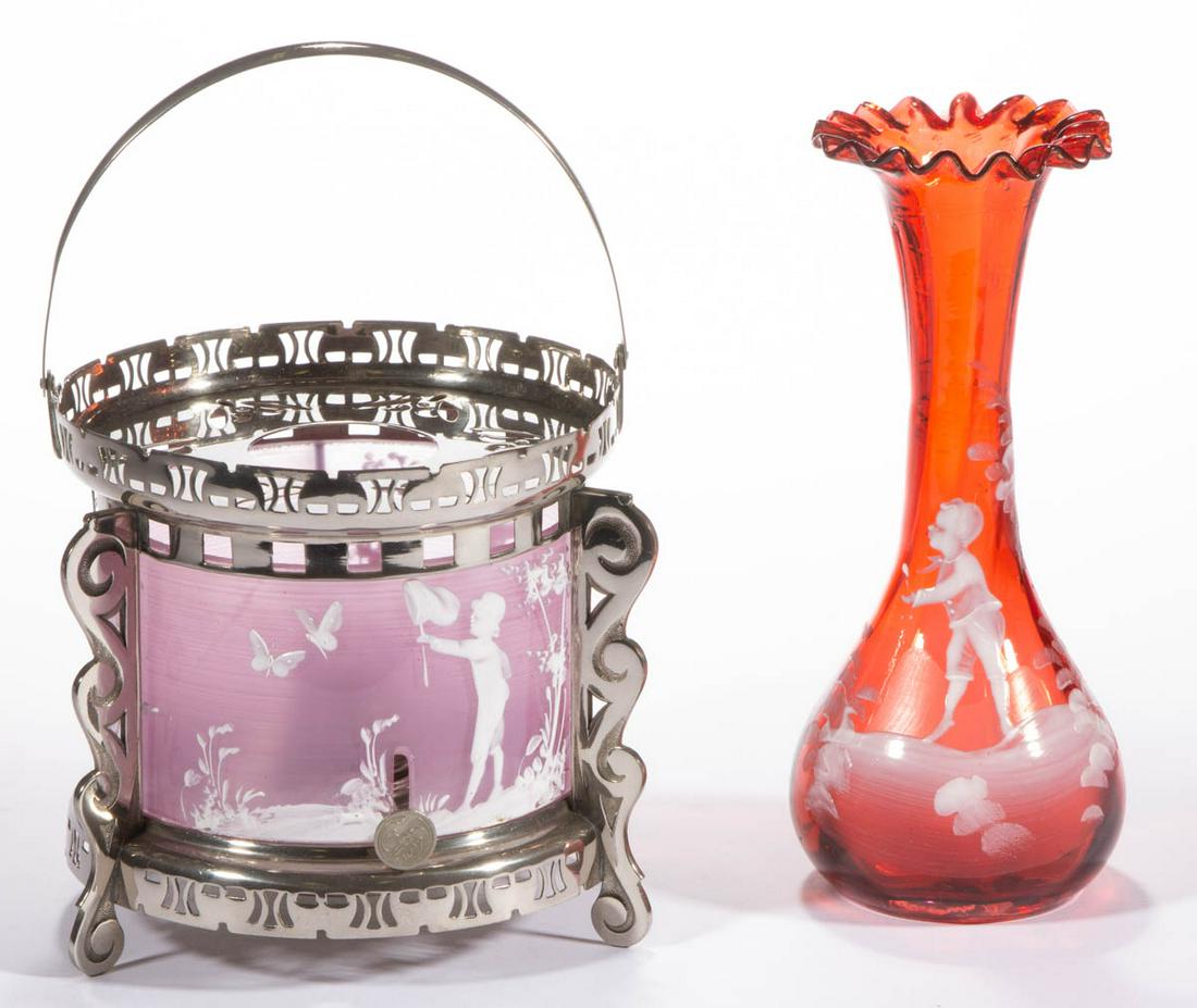MARY GREGORY (SO-CALLED) DECORATED GLASS ARTICLES, LOT: MARY GREGORY (SO-CALLED) DECORATED GLASS ARTICLES, LOT OF TWO, ruby and colorless with maiden's blush-staining, comprising a bulb vase depicting a boy with his hand out, and a tea warmer with an inter