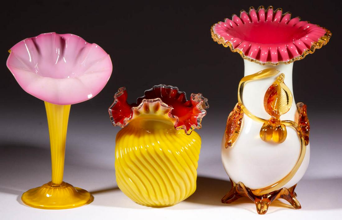 ASSORTED VICTORIAN CASED GLASS VASES, LOT OF THREE: ASSORTED VICTORIAN CASED GLASS VASES, LOT OF THREE, comprising a yellow to cranberry square and pinched example, an opaque white to cranberry baluster-form example with applied decoration, and a yello