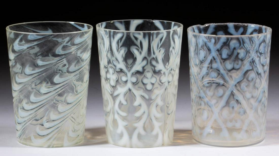 ASSORTED BLOWN OPALESCENT TUMBLERS, LOT OF THREE: ASSORTED BLOWN OPALESCENT TUMBLERS, LOT OF THREE, colorless opalescent, comprising a Daisy in Criss-Cross, a Spanish Lace, and a Blown Twist. Various makers. Late 19th/early 20th century. 3 3/4" to 4"