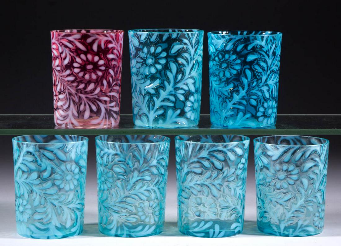 DAISY AND FERN OPALESCENT TUMBLERS, LOT OF SEVEN: DAISY AND FERN OPALESCENT TUMBLERS, LOT OF SEVEN, comprising six blue opalescent and a cranberry opalescent example, each having a factory-polished rim. Various makers. Late 19th/early 20th century. 3