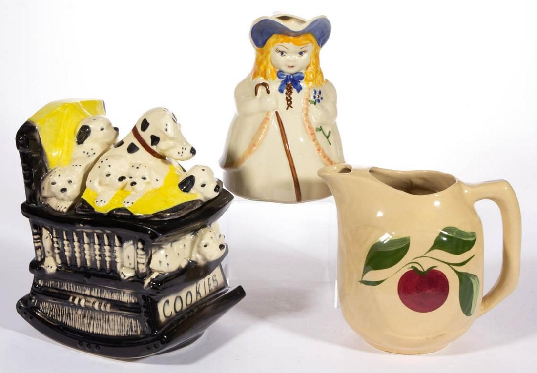 AMERICAN HAND-PAINTED ART POTTERY ARTICLES, LOT OF: AMERICAN HAND-PAINTED ART POTTERY ARTICLES, LOT OF THREE, comprising a McCoy cookie jar featuring Dalmatian dogs piled onto a rocking chair with "cookies" hand-brushed to front, a Watt Pottery pitcher