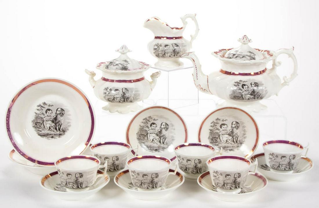 ENGLISH BAT-PRINTED PINK LUSTRE CERAMIC 17-PIECE TEA: ENGLISH BAT-PRINTED PINK LUSTRE CERAMIC 17-PIECE TEA SET, comprising a teapot, a covered sugar, a creamer, two 7 3/4" steep-sided plates, and six cup and saucer sets, each featuring charming black tra