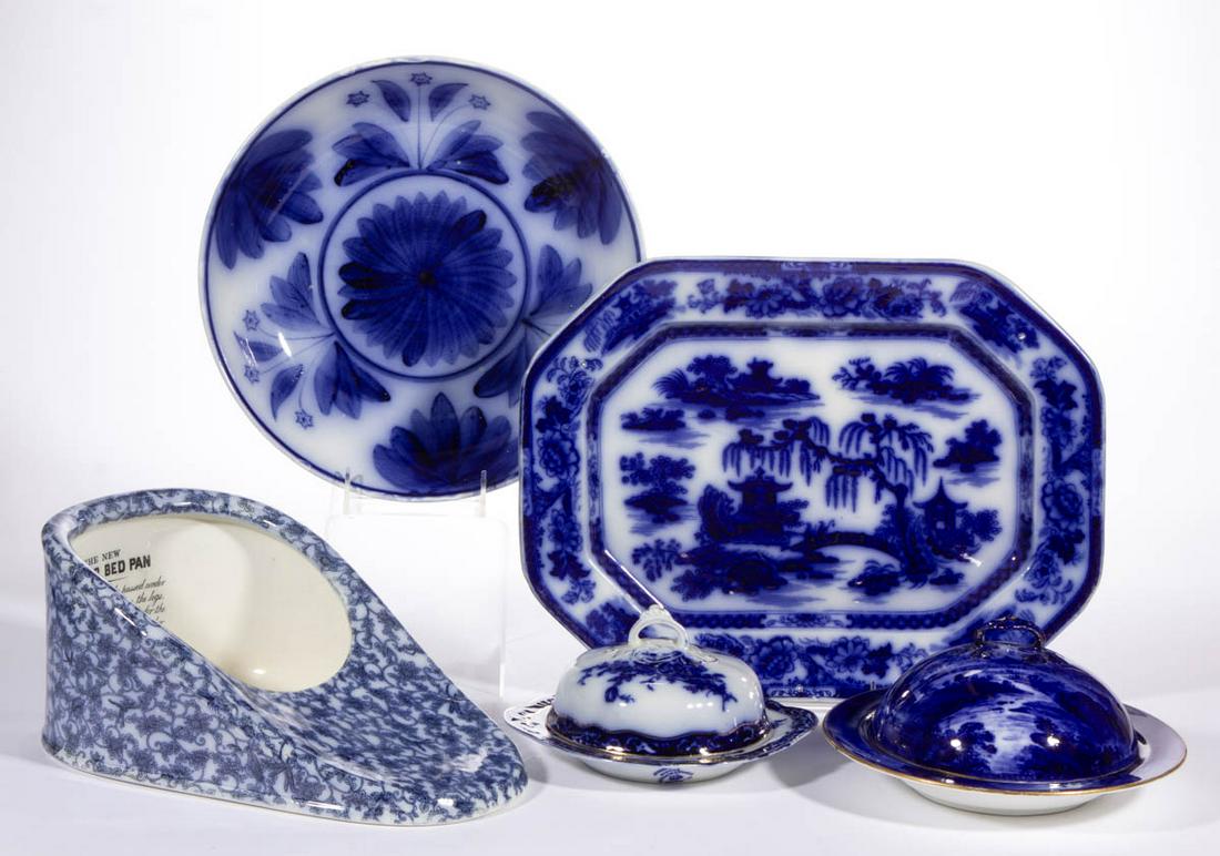 ENGLISH FLOW BLUE CERAMIC ARTICLES, LOT OF FOUR: ENGLISH FLOW BLUE CERAMIC ARTICLES, LOT OF FOUR, comprising two covered butter dishes including one featuring a castle in landscape to interior and cover, a rectangular platter with Chinoiserie design